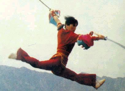 a young girl demonstrating magnificient wushu